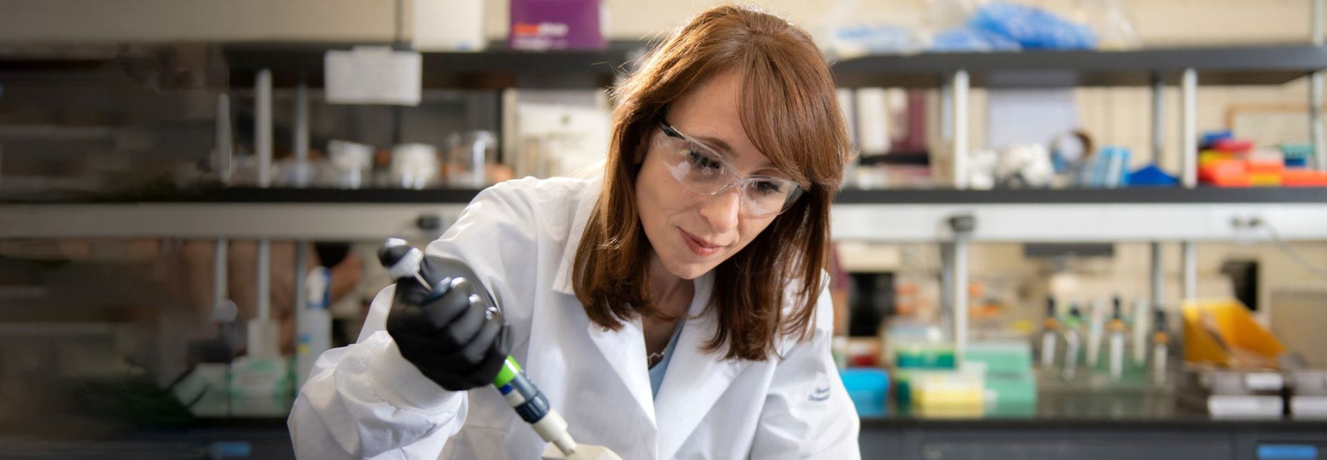 Amal Alackar professor of Pharm Sci/SOM at work in her lab