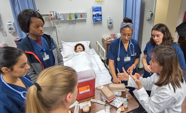 Nursing students being trained in a simulation lab