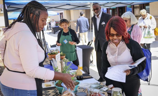 residents at food and herb booth